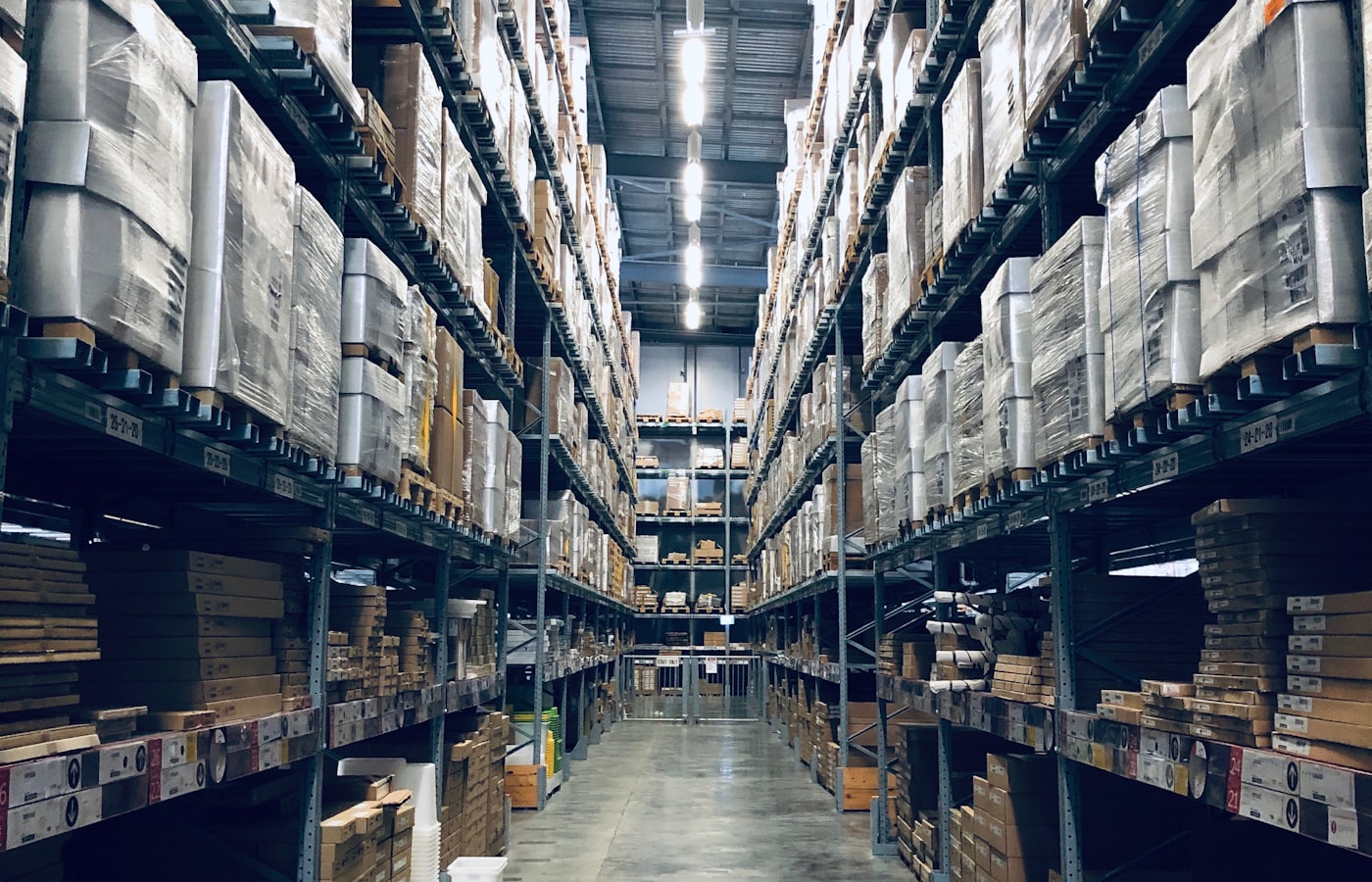 Organised warehouse aisle representing professional shipping operations