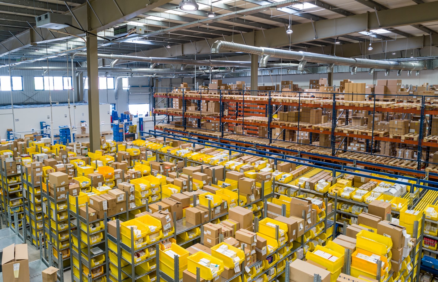 Warehouse shelves stacked with parcels prepared for shipping